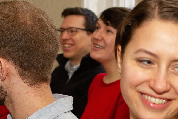 Photo of students smiling in class