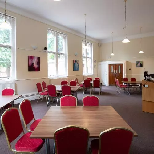 Photo of the Lower Common Room in cabaret layout with chairs set around square tables