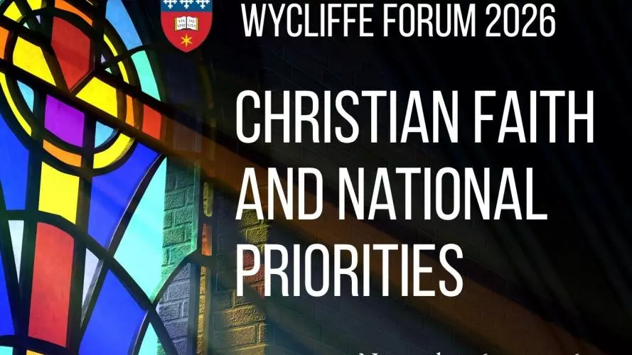 Text Christian Faith and National Priorities on an image of a stained glass window of a cross with light shining through at a podium