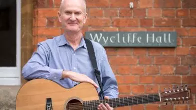 David Clifton in front of Wycliffe Hall sign
