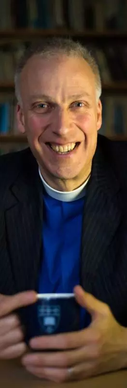 Michael Lloyd holding a mug