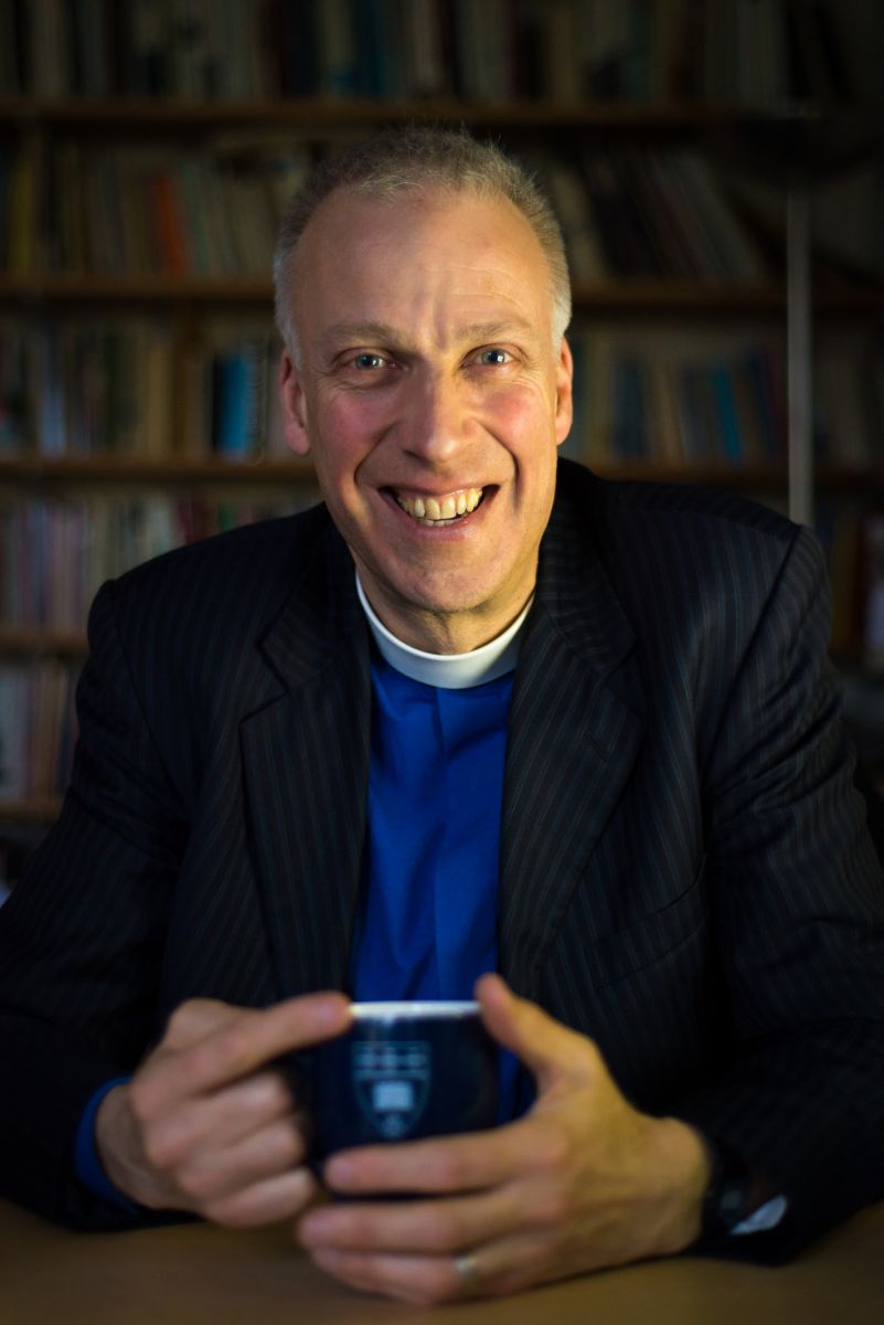 Michael Lloyd holding a mug